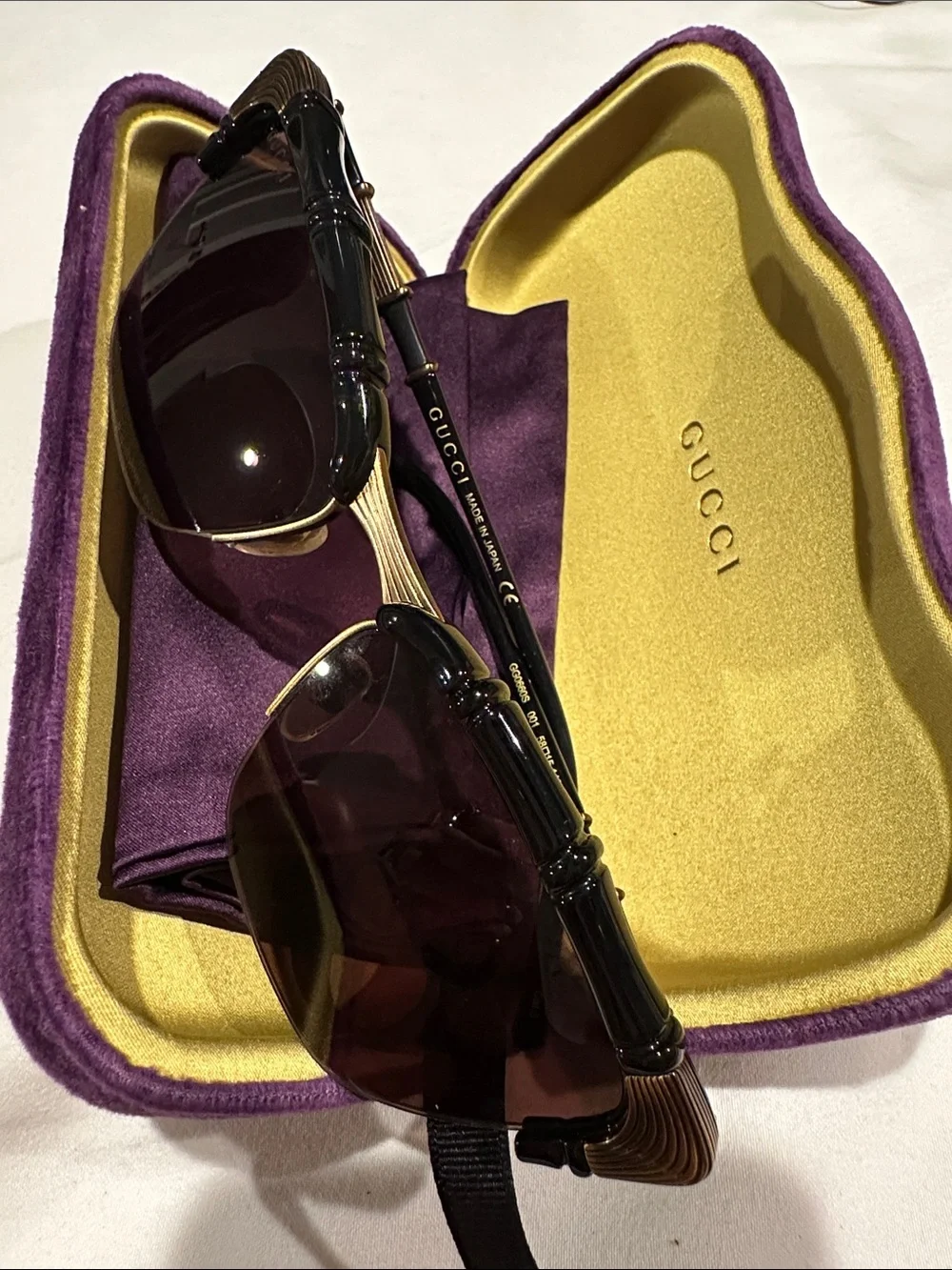 Limited edition Gucci Black Sunglasses with Gold Accents in Yellow & Purple Case